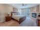 Spacious bedroom with a fireplace, carpet, and a sliding glass door at 8950 E Greenview Dr, Gold Canyon, AZ 85118