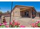 Cozy backyard featuring a covered patio, low-maintenance landscaping, and decorative accents, perfect for outdoor relaxation and enjoyment at 9175 E Rainier Dr, Gold Canyon, AZ 85118