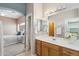 Bright bathroom showcases vanity with ample storage, a large mirror, and convenient access to the main bedroom at 9175 E Rainier Dr, Gold Canyon, AZ 85118