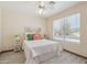 Bright bedroom features stylish decor, neutral walls, and a comfortable bed for a cozy retreat at 9175 E Rainier Dr, Gold Canyon, AZ 85118