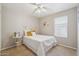 Cozy bedroom filled with natural light, neutral walls, and comfortable furnishings for a relaxing retreat at 9175 E Rainier Dr, Gold Canyon, AZ 85118