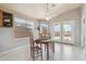 Bright dining room with french doors, a window, and decor at 9175 E Rainier Dr, Gold Canyon, AZ 85118