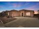 Charming single-story home with tile roof, neutral stucco, spacious driveway, and well-maintained landscaping in a friendly community at 9175 E Rainier Dr, Gold Canyon, AZ 85118