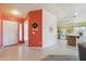 Welcoming foyer leads to a modern kitchen featuring a large island, white appliances, and ample counter space, perfect for cooking at 9175 E Rainier Dr, Gold Canyon, AZ 85118