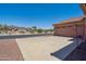 Spacious two car garage with concrete driveway and desert landscaping on a sunny day at 9175 E Rainier Dr, Gold Canyon, AZ 85118