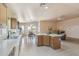 Spacious open-concept kitchen and dining area features ample cabinetry and access to an outdoor area at 9175 E Rainier Dr, Gold Canyon, AZ 85118