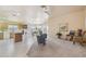 Open concept living room with ceiling fan, kitchen access and furniture at 9175 E Rainier Dr, Gold Canyon, AZ 85118