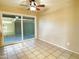 Bedroom featuring ceramic tile floors, ceiling fan, and sliding glass doors to backyard at 924 S Hacienda Dr # C, Tempe, AZ 85281