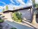 Home exterior featuring desert landscaping, private courtyard, and mature tree at 924 S Hacienda Dr # C, Tempe, AZ 85281
