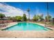 Community swimming pool with lounge chairs and clear blue water at 924 S Hacienda Dr # C, Tempe, AZ 85281