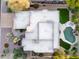 Birds eye view of the home showing the backyard pool, landscaping and patio with seating at 9322 E Hidden Green Dr, Scottsdale, AZ 85262