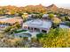 Beautiful aerial view showcasing the home's pool, patio, and well-maintained landscaping at 9322 E Hidden Green Dr, Scottsdale, AZ 85262