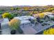 Desert home showcasing low-maintenance landscaping, three-car garage, and inviting curb appeal at 9322 E Hidden Green Dr, Scottsdale, AZ 85262