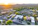 Beautiful sunset shot of homes nestled in a desert landscape with mountain views in the background at 9322 E Hidden Green Dr, Scottsdale, AZ 85262