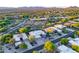 Aerial view of multiple homes in desert landscape featuring neighborhood street and mountain views at 9322 E Hidden Green Dr, Scottsdale, AZ 85262