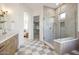 Modern bathroom features a glass shower, tiled floor, and stylish vanity at 9322 E Hidden Green Dr, Scottsdale, AZ 85262