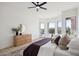 Primary bedroom boasts bright windows, backyard access, and wood dresser at 9322 E Hidden Green Dr, Scottsdale, AZ 85262