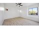 Bright, airy bedroom with hardwood floors and ample natural light, offering a serene and inviting atmosphere at 9322 E Hidden Green Dr, Scottsdale, AZ 85262