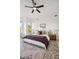 Bright bedroom with a plush bed, stylish rug, and ample natural light at 9322 E Hidden Green Dr, Scottsdale, AZ 85262
