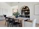 Elegant dining room showcasing a wooden table, black chairs, and chic decor at 9322 E Hidden Green Dr, Scottsdale, AZ 85262