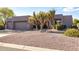 Charming single-story home with desert landscaping and a neutral color palette at 9322 E Hidden Green Dr, Scottsdale, AZ 85262