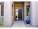 Inviting front entry with a stone walkway, tasteful decor, and natural light at 9322 E Hidden Green Dr, Scottsdale, AZ 85262