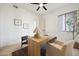 Bright home office with natural light, modern desk, hardwood floors, and stylish decor at 9322 E Hidden Green Dr, Scottsdale, AZ 85262