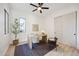 Bright home office with natural light, a modern desk, and hardwood floors, perfect for a productive workspace at 9322 E Hidden Green Dr, Scottsdale, AZ 85262
