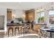 Beautiful kitchen with updated appliances, a center island with seating, and warm wooden cabinets at 9322 E Hidden Green Dr, Scottsdale, AZ 85262