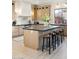 Modern kitchen island with bar stool seating and ample counter space at 9322 E Hidden Green Dr, Scottsdale, AZ 85262