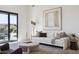Comfortable living room with neutral tones, light wood floors, and a view of the outdoor space at 9322 E Hidden Green Dr, Scottsdale, AZ 85262