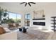Stylish living room showcasing a fireplace, comfortable seating, and views of the outdoor space at 9322 E Hidden Green Dr, Scottsdale, AZ 85262