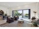 Open living room design with large sliding doors to outdoor space at 9322 E Hidden Green Dr, Scottsdale, AZ 85262