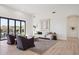 Bright living room with comfortable seating and seamless access to the outdoor patio at 9322 E Hidden Green Dr, Scottsdale, AZ 85262