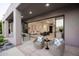 Comfortable patio space with ample seating, offering seamless indoor-outdoor living and scenic views at 9322 E Hidden Green Dr, Scottsdale, AZ 85262