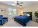 Relaxing bedroom with a bed, sitting chair, and large window that provides an abundance of natural light at 9745 N 95Th St # 227, Scottsdale, AZ 85258