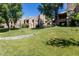 Well-maintained lawn with mature landscaping and residential buildings at 9745 N 95Th St # 227, Scottsdale, AZ 85258