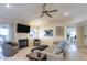 Bright living room with fireplace, ceiling fan, and neutral decor for a relaxing atmosphere at 9745 N 95Th St # 227, Scottsdale, AZ 85258
