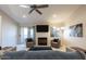 Inviting living room with fireplace, patio access, and comfortable seating arrangement at 9745 N 95Th St # 227, Scottsdale, AZ 85258