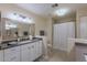 Bright main bathroom with double sinks, framed mirrors, and separate shower and toilet areas at 9745 N 95Th St # 227, Scottsdale, AZ 85258