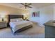 Spacious main bedroom with ceiling fan, neutral colors, and ample closet space at 9745 N 95Th St # 227, Scottsdale, AZ 85258