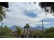 Beautiful mountain view with puffy clouds and clear blue sky from this community's well-maintained landscaping at 9745 N 95Th St # 227, Scottsdale, AZ 85258