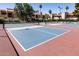 Pickleball court area surrounded by trees and landscaping at 9745 N 95Th St # 227, Scottsdale, AZ 85258