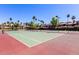 Well-maintained tennis court surrounded by trees and landscaping at 9745 N 95Th St # 227, Scottsdale, AZ 85258
