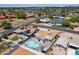 Aerial view of property featuring a backyard pool, mature landscaping, and nearby residential area at 1011 W Weldon Ave, Phoenix, AZ 85013