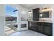 Well lit bathroom with outdoor access, and sinks and dark wood cabinets at 1011 W Weldon Ave, Phoenix, AZ 85013