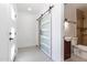 Hallway leading to the bathroom with sliding glass door at 1011 W Weldon Ave, Phoenix, AZ 85013