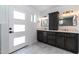 Modern bathroom features and sinks and dark wood cabinets at 1011 W Weldon Ave, Phoenix, AZ 85013