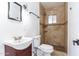 Well-lit bathroom with a stone shower, providing a relaxing and modern experience at 1011 W Weldon Ave, Phoenix, AZ 85013