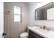 Modern powder room with designer vanity, and neutral-toned tiling at 1011 W Weldon Ave, Phoenix, AZ 85013